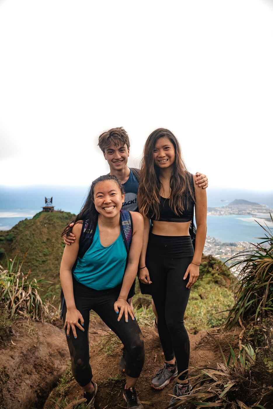 Karis with her partner at a coastal viewpoint — still living life