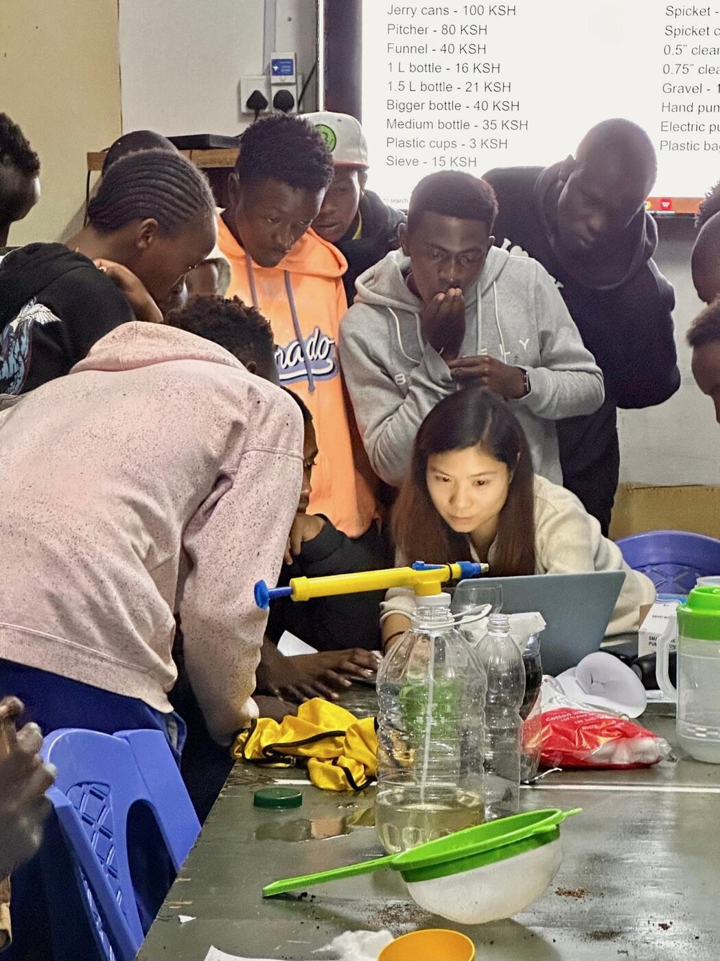 Karis working with Kenyan youth on a community project — at the heart of the work the Hope Fund supports