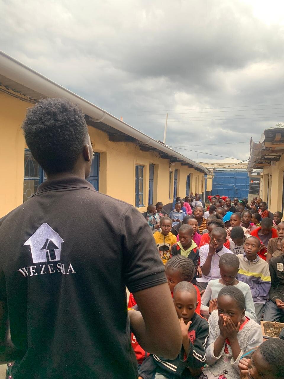 A Wezesha staff member addressing students at the empowerment center in Kasarani