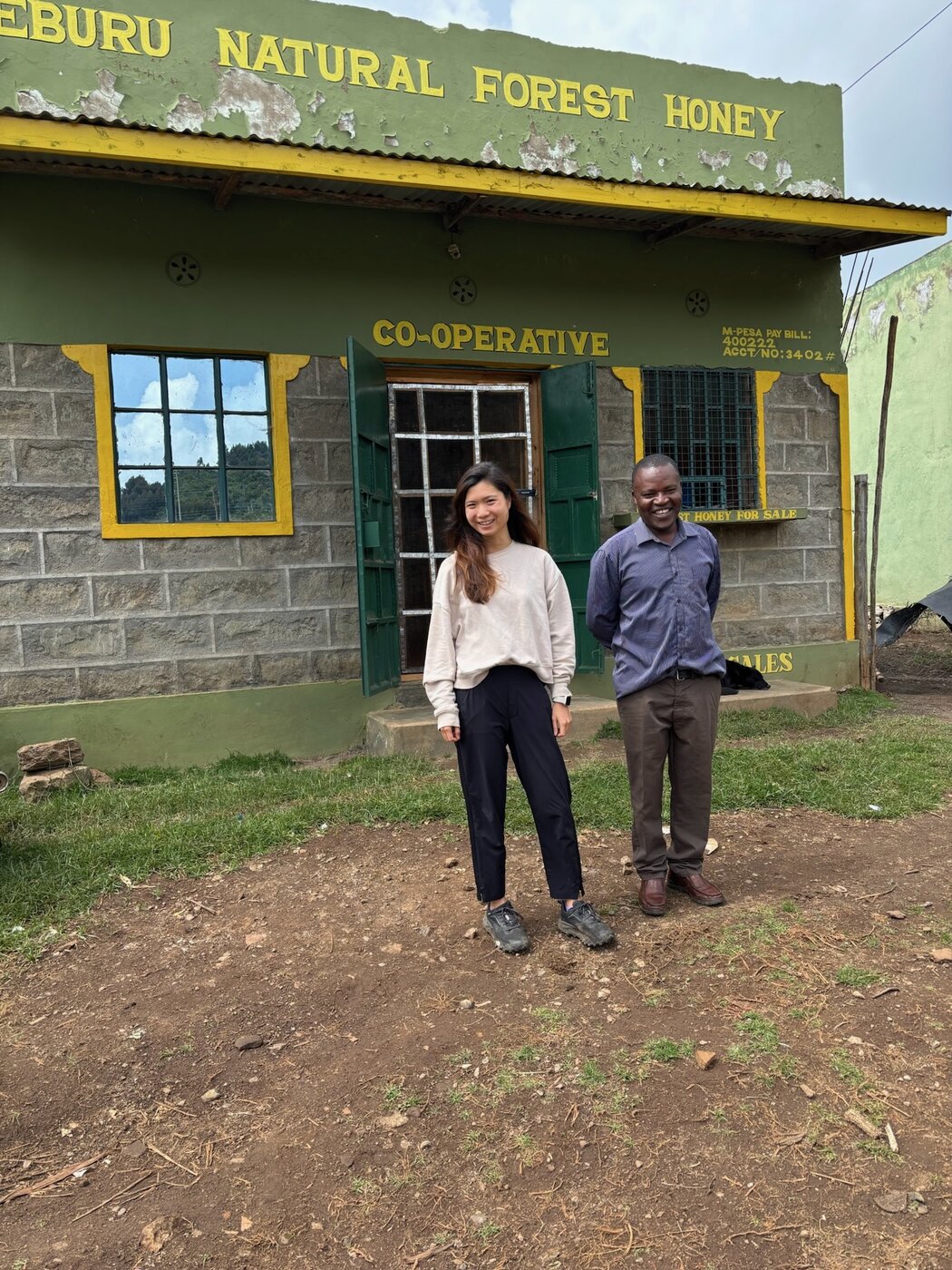 Karis with a colleague — at work in the field in Kenya