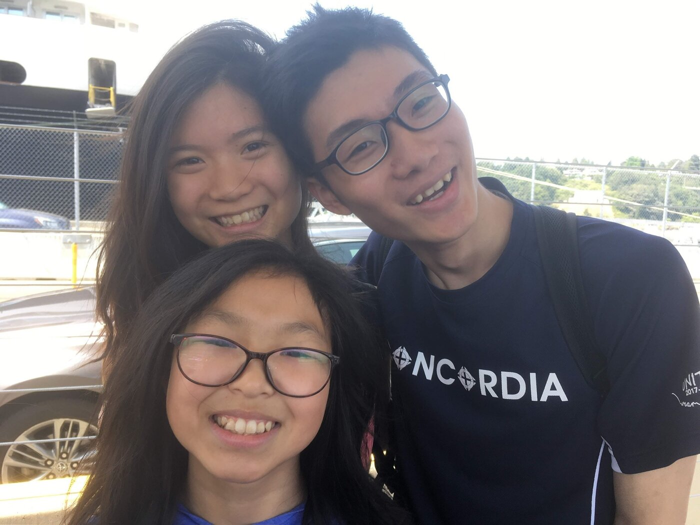 Karis as a teenager with her sister Anastasia and a friend wearing a Concordia shirt
